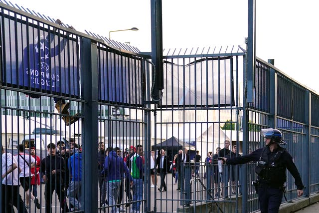 Police use pepper spray against fans outside the ground (Adam Davy/PA)