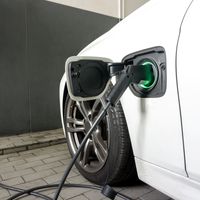 Electric car connected to charging station