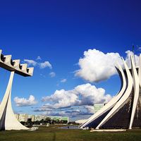 Cathedral of Brasilia, Brazil, designed by Oscar Niemeyer, built in the shape of a crown of thorns. Its bell tower is at the left.