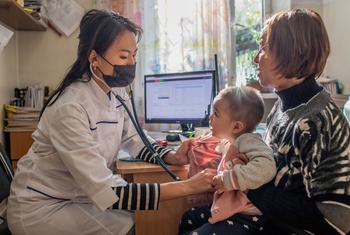 An 18-month-old girl receives routine childhood vaccinations in Kyrgyzstan.