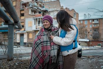 Olena stands in front of her damaged home in Kharkiv, hit during a May 2024 attack (file)