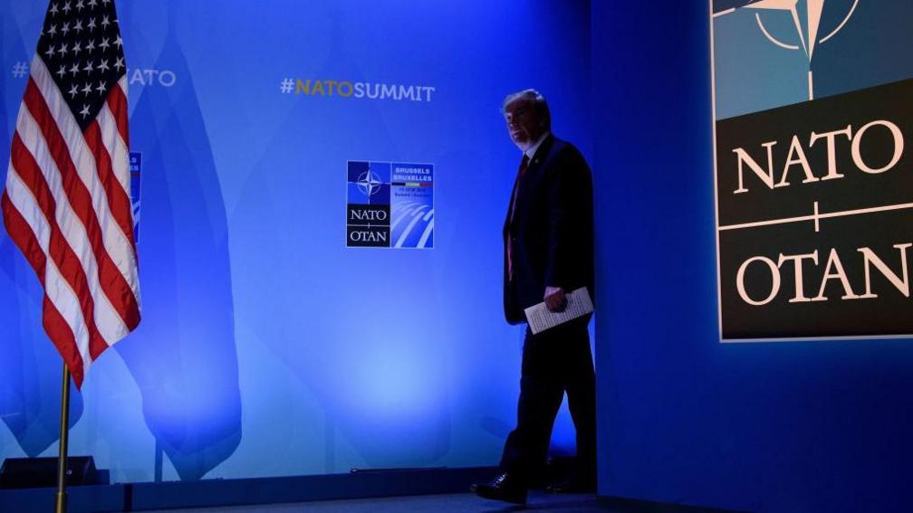 US President Donald Trump arrives for a press conference on the second day of the North Atlantic Treaty Organization (NATO) summit in Brussels on July 12, 2018.