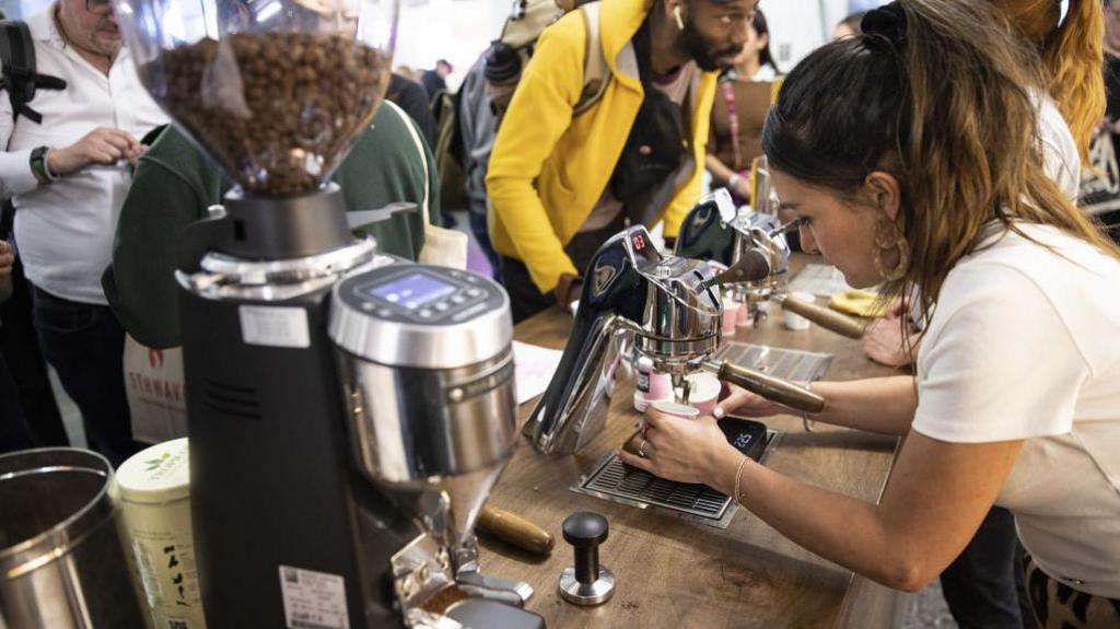 People participate in the London Coffee Festival at The Truman Brewery Markets in London, United Kingdom 