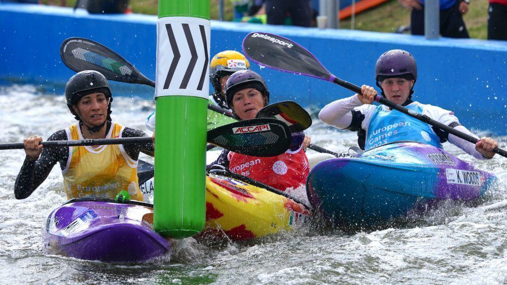 Kimberley Woods competes in kayak cross at the World Championships