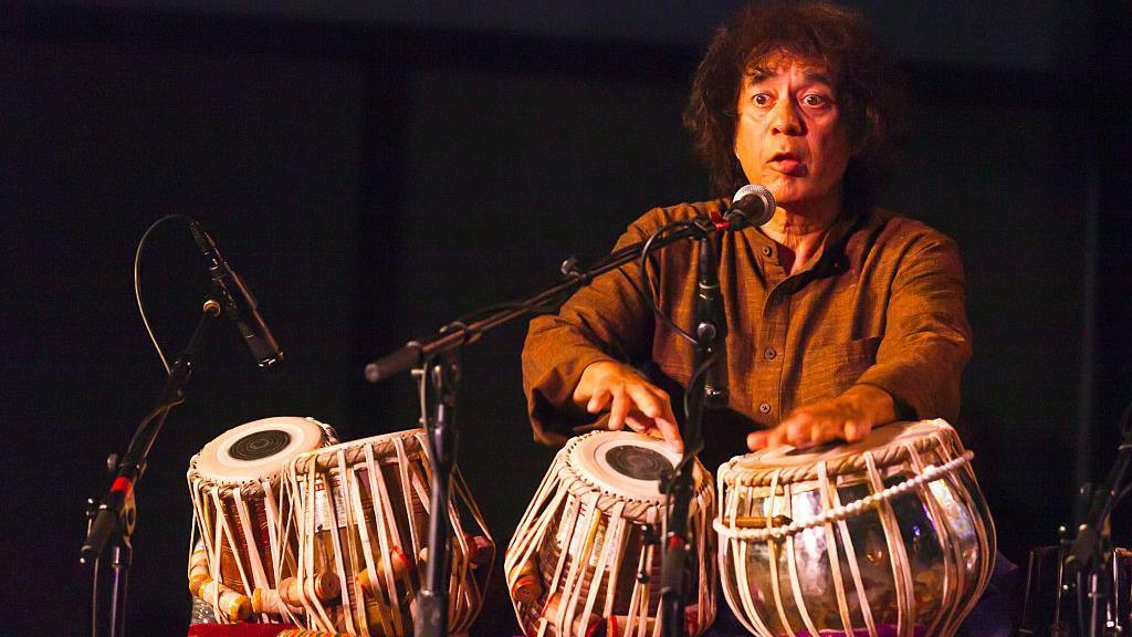 CHARLES LLOYD on saxophone, ZAKIR HUSSAIN on tablas and ERIC HARLAND on drums preform as SANGAM at the MONTEREY JAZZ FESTIVAL (Photo by Craig Lovel