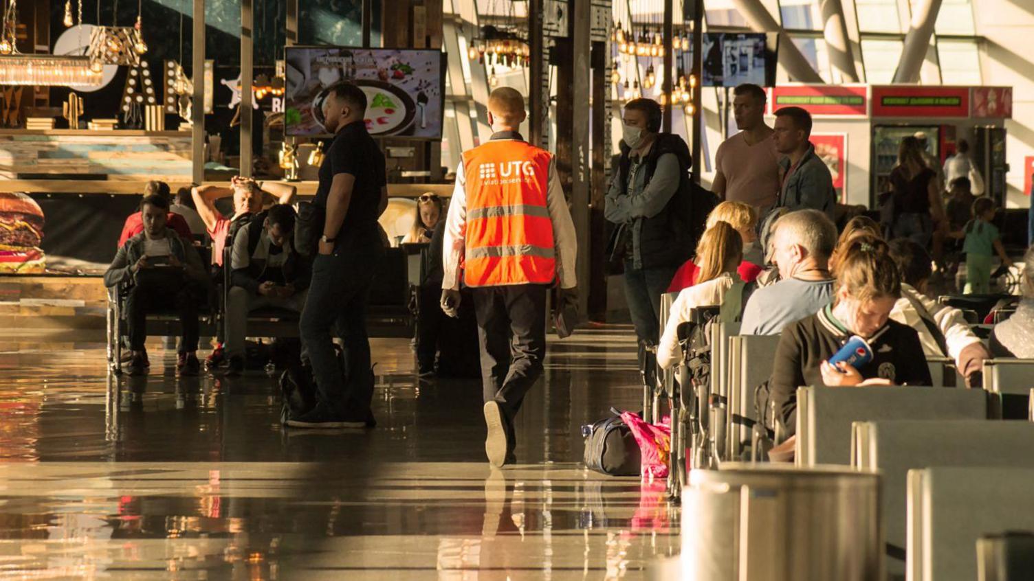 A crowded hall in a waiting area of a terminal in Vnukovo International Airport (stock image)