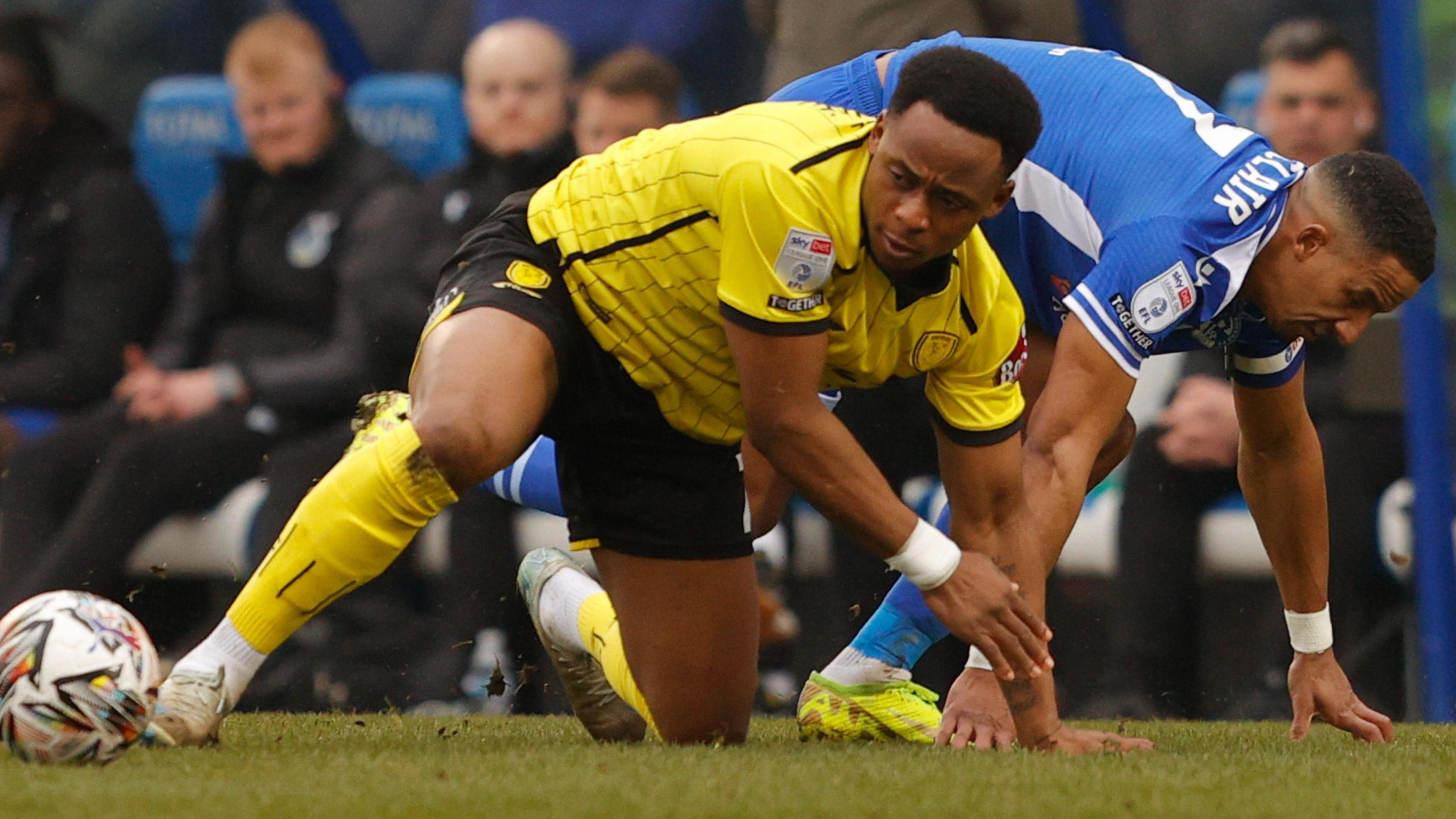 Udoka Godwin-Malife wins the ball in a challenge against Bristol Rovers