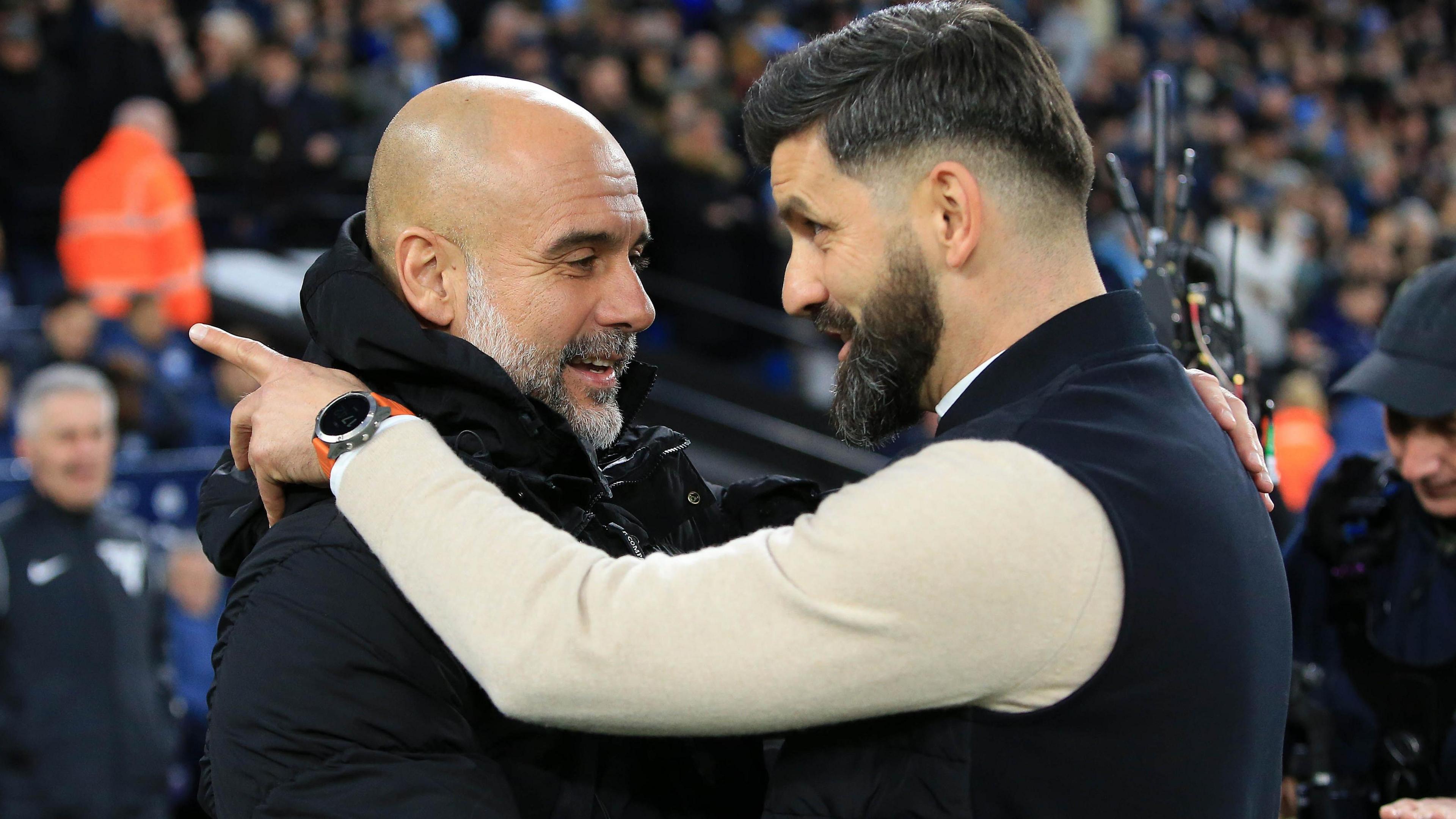 Pep Guardiola and Miron Muslic embrace