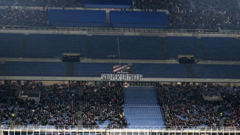 Supporters of AC Milan protest during the Serie A match between AC Milan and  Lazio