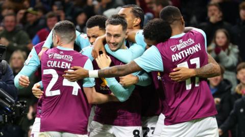 Josh Brownhill of Burnley celebrates scoring his team's second goal with teammates during the Championship match between Burnley FC and Sheffield Wednesday FC at Turf Moor