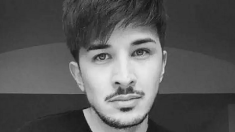 A black and white family handout of Martyn Hett. He has dark hair and is wearing a dark shirt.