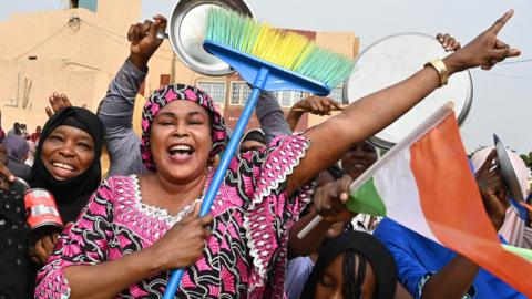 Supporters of Niger's junta protest outside the Niger and French airbase in Niamey to demand the departure of the French army - August 2023