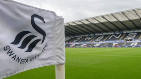 Swansea City crest on a corner flag