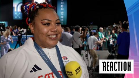 Watch as Campbell reacts to winning bronze in the women's +81kg weightlifting