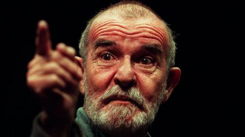 Athol Fugard, bald and bearded, points a finger (1 March 1997)