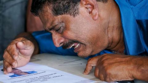  Relative Mourns Near Deceased Cibin Abraham After His Coffin Arrived On An Indian Air Force Plane From Kuwait At The Cochin International Airport In Kochi On June 14, 2024.