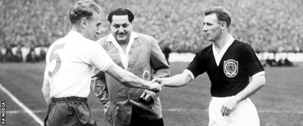 Tommy Docherty (right) captains Scotland against England