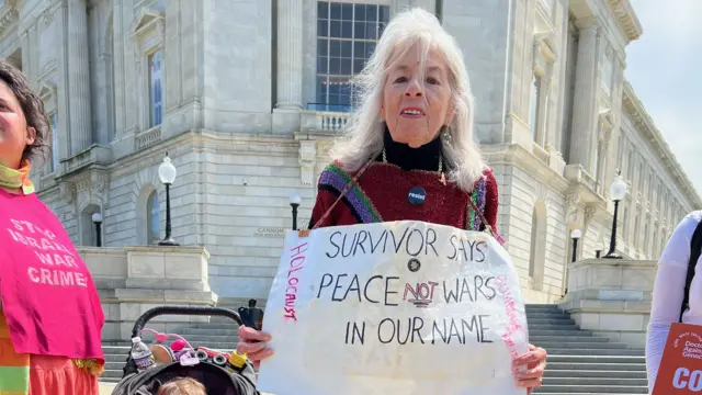 Marion Ingram Holding a sign