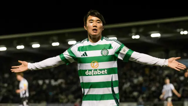 Celtic's Hyunju Yang celebrates as he scores to make it 3-2 during a William Hill Premiership match between St Mirren and Celtic at the SMiSA Stadium