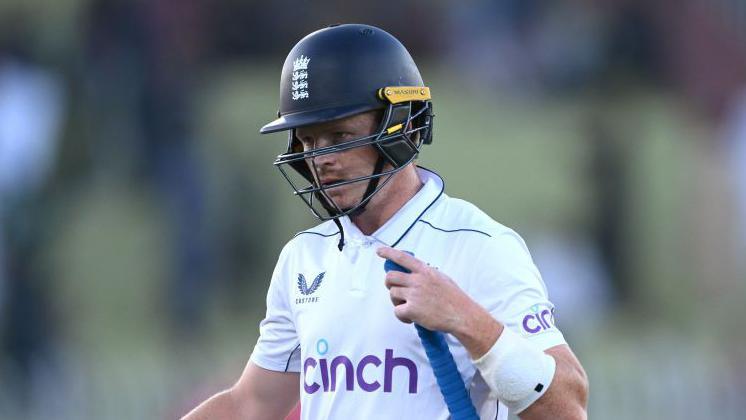 England batter Ollie Pope walks off after being dismissed