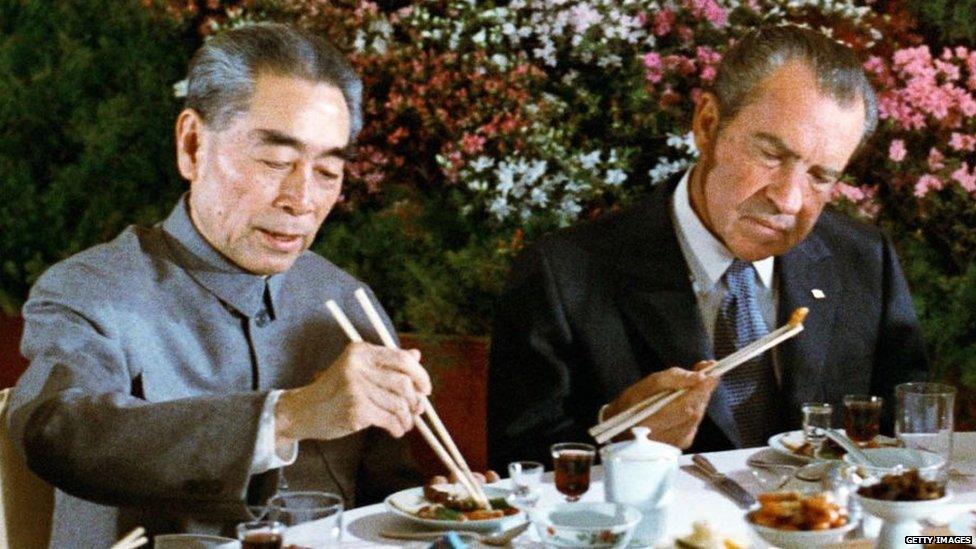 Richard Nixon eats dinner with Chinese Premier Zhou Enlai