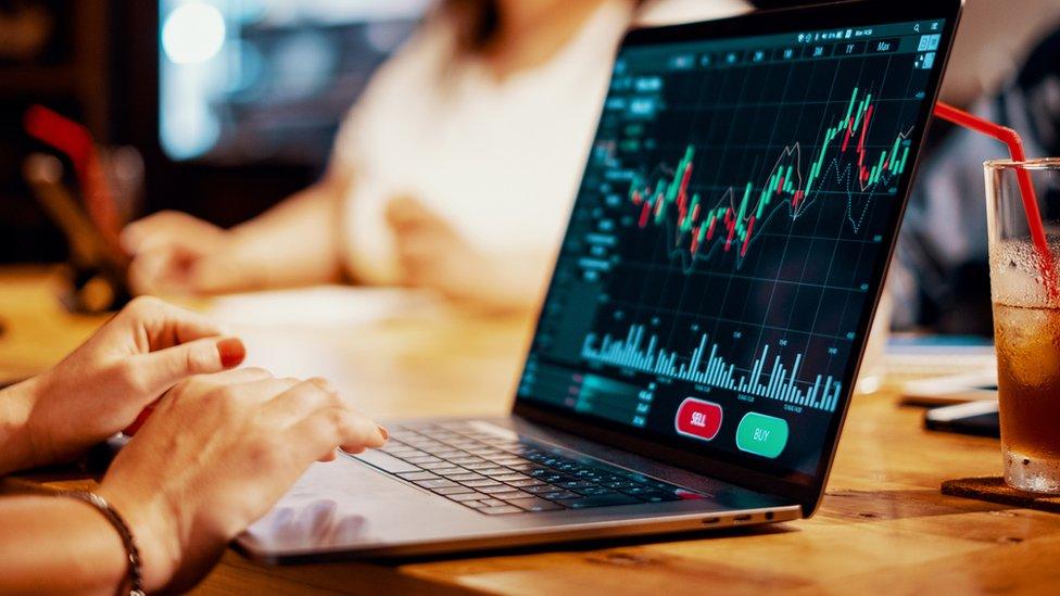 A laptop showing stock market prices