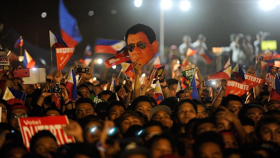 Supporters of presidential frontrunner Rodrigo Duterte cheer during his final campaign rally on May 7, 2016 in Manila, Philippines