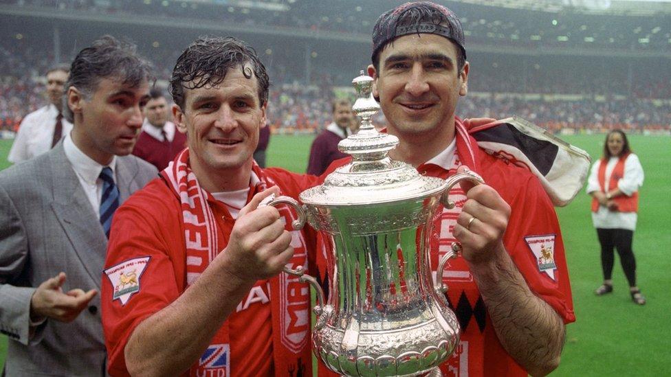 Mark Hughes and Eric Cantona holding the FA Cup