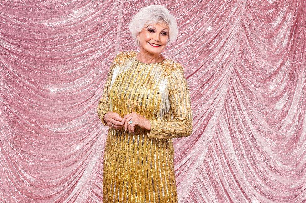 Angela Rippon in a flapper-style gold dress