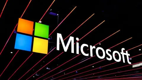 Getty Images A Microsoft logo displayed against black beams