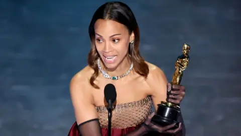 Getty Images Zoe Saldaña accepts the award for Best Actress in a Supporting Role for "Emilia Perez" onstage during the 97th Annual Academy Awards at the Dolby Theatre in Hollywood, California on March 2, 2025