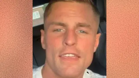 Police Scotland A selfie of Jamie Lucas smiling at the camera. He has a tanned complexion and short blonde hair combed in a side shed. He appears to be sitting in a car. 