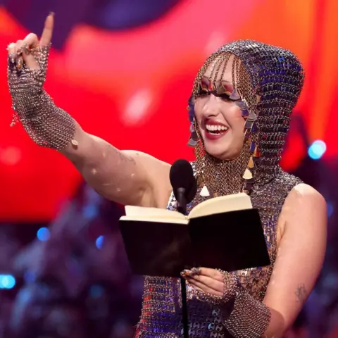 Getty Images Chappell Roan accepts the best new artist prize at the 2024 MTV VMAs