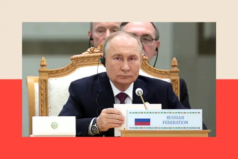 Getty Images Russia's President Vladimir Putin looks on during an international forum 