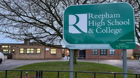 Shaun Whitmore/BBC External photograph of the Reepham High School and College building, with a sign bearing the school's name in the foreground.