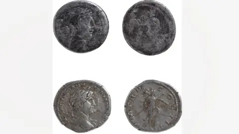 Andrew Williams/Norfolk County Council The front and back of two silver Roman coins. The one on the top is the oldest and has been worn almost smooth. A man's face wearing laurel leaves in profile can be seen, while facing it its back is so smooth the pattern lacks definition. The one below shows the emperor Hadrian in profile. Facing it is the reverse showing the god Mars, wearing a helmet and holding a spear.