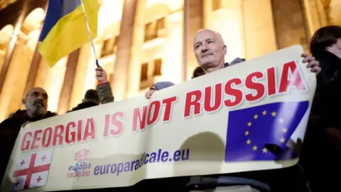 Thousands protested against the contested result outside parliament on Monday in Tbilisi