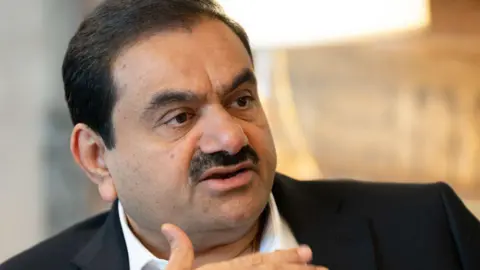 Getty Images Gautam Adani, chairman of Adani Group, during a Bloomberg Television interview at the company's headquarters in Ahmedabad, Gujarat, India, on Saturday, May 25, 2024. Gautam Adani says he'll shift control to his scions in the early 2030s. Photographer: Sumit Dayal/Bloomberg via Getty Images