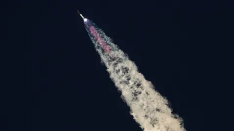 Reuters SpaceX's Starship flies during its fifth flight test, in Boca Chica, Texas.