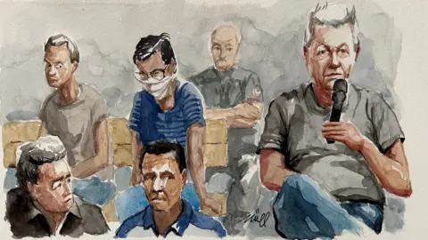 Reuters A court sketch of some of the 50 defendants