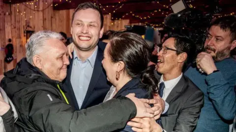 Chairman of Demokraatit, Jens-Frederik Nielsen (C), celebrates during the election party at Demokraatit by cafe Killut in Nuuk, March 11, 2025